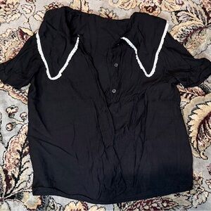 Elegant Black Top with White Accents